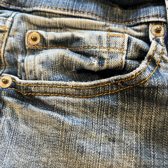 Torrid Blue Flare Jeans with Distressed Details - Picture 5 of 11